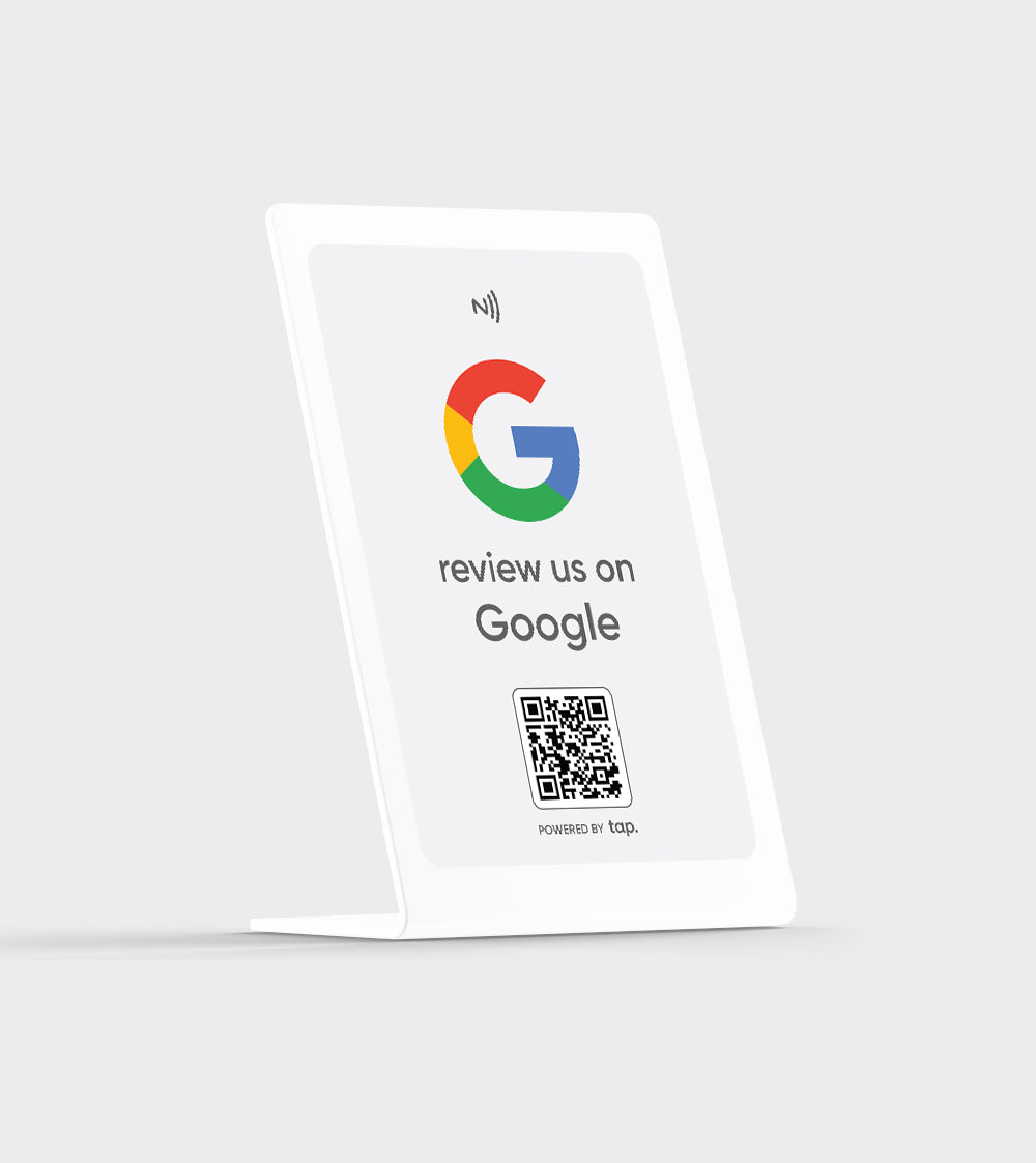 Google review request sign with QR code on a tabletop display.