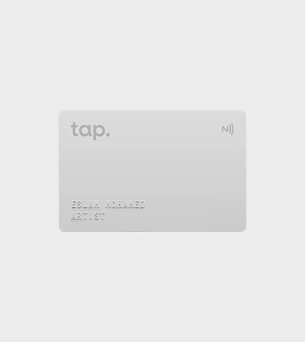 Modern contactless NFC card with embossed name and title on a gray background.
