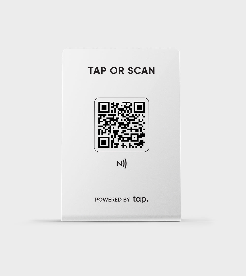 White NFC card with QR code labeled TAP OR SCAN" for contactless interaction, powered by Tap.