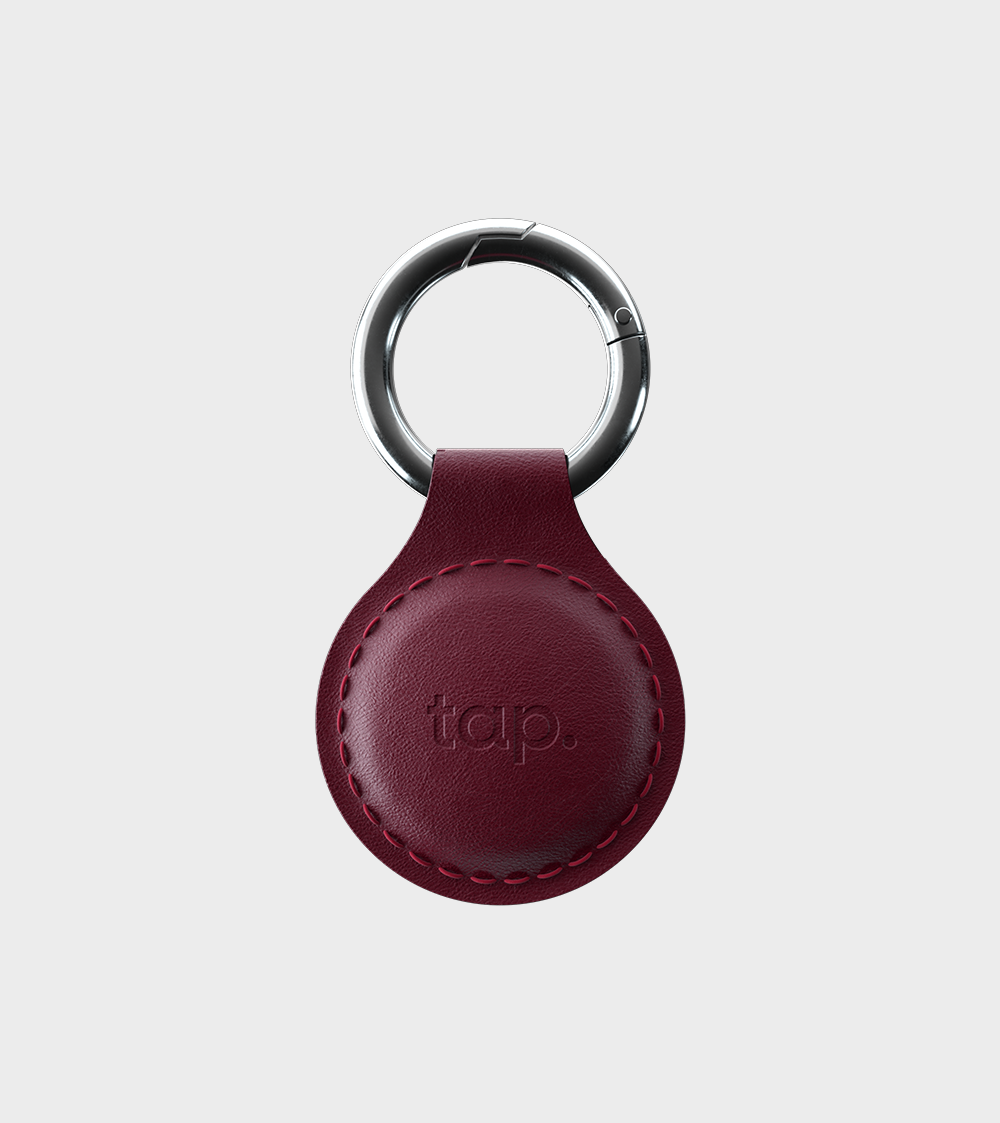 Red leather keychain with stitched details and metal ring