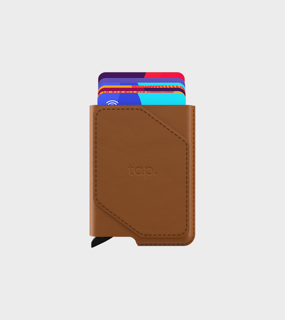 Brown leather wallet with colorful credit cards peeking out on a white background.