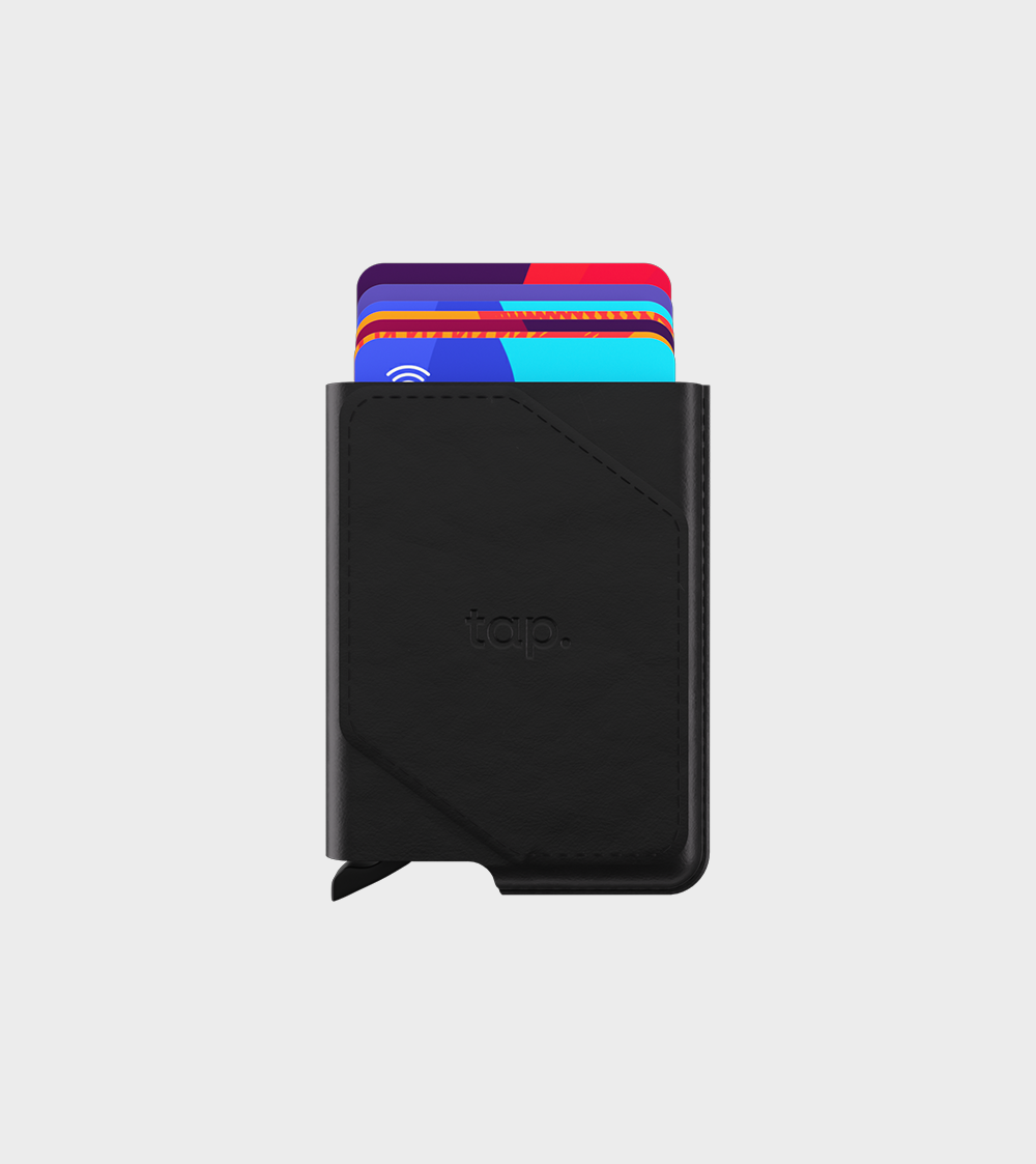 Black minimalist wallet with contactless credit cards sticking out, isolated on a white background.
