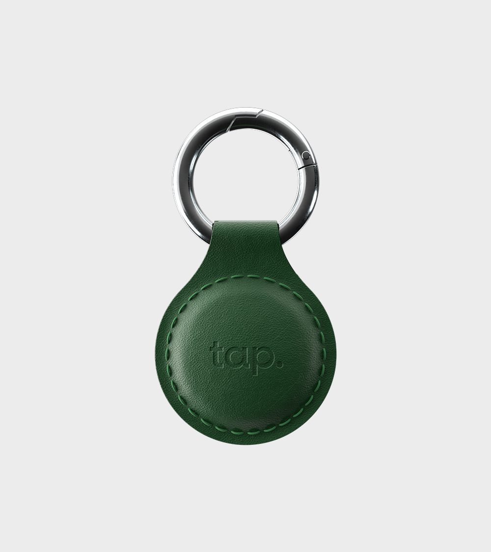 Green leather keychain with silver ring and 'tap' branding