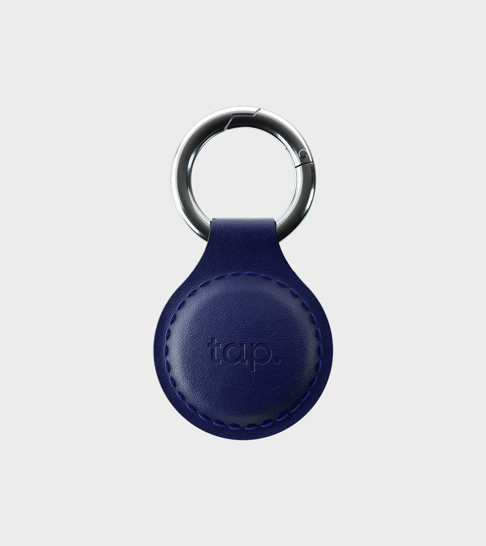 Blue leather keyring with silver ring and embossed logo on a white background for personal accessories.