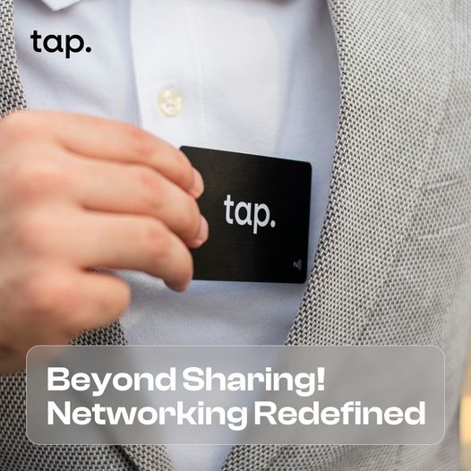 Person inserting a 'tap.' NFC business card into pocket with tagline Beyond Sharing! Networking Redefined" for professional networking.