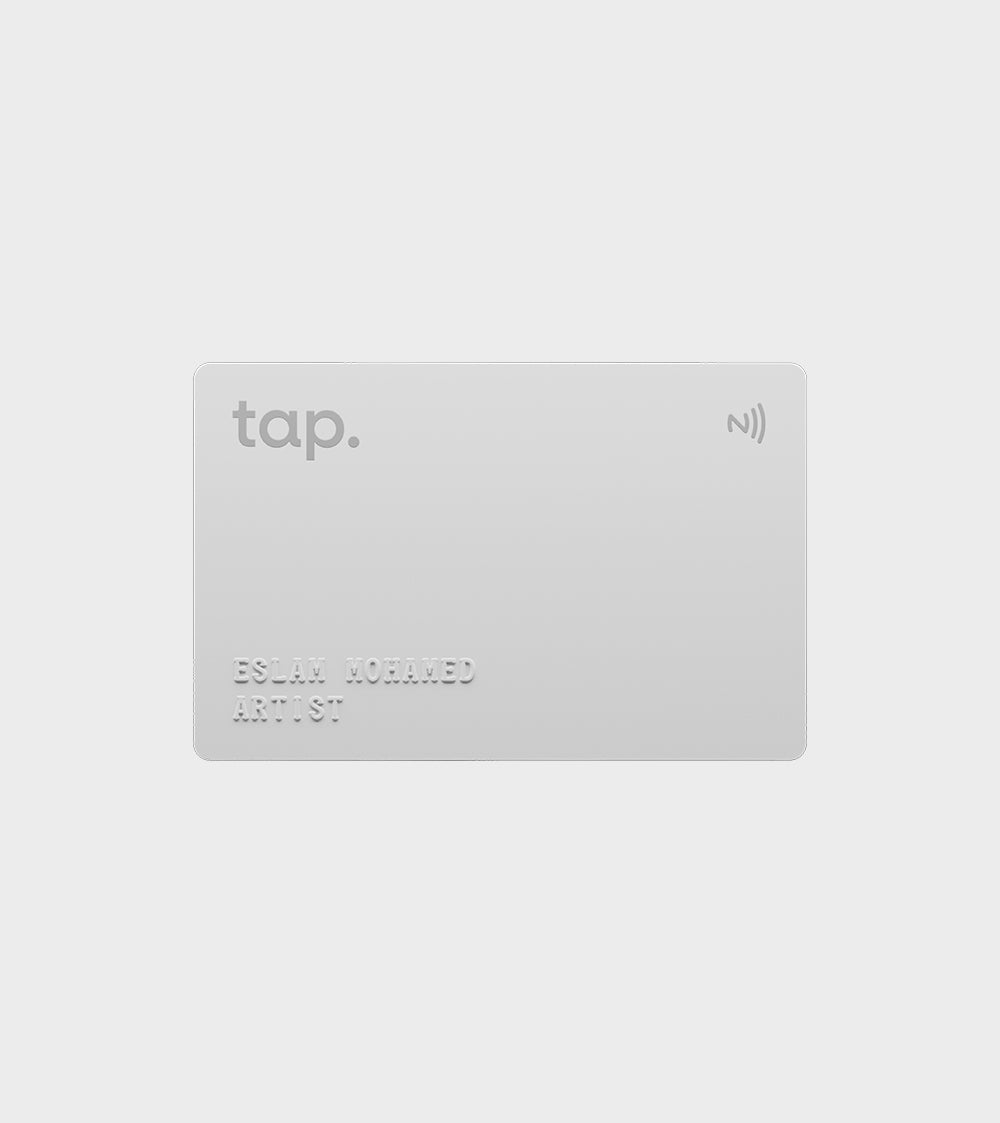 Modern contactless NFC card with embossed name and title on a gray background.