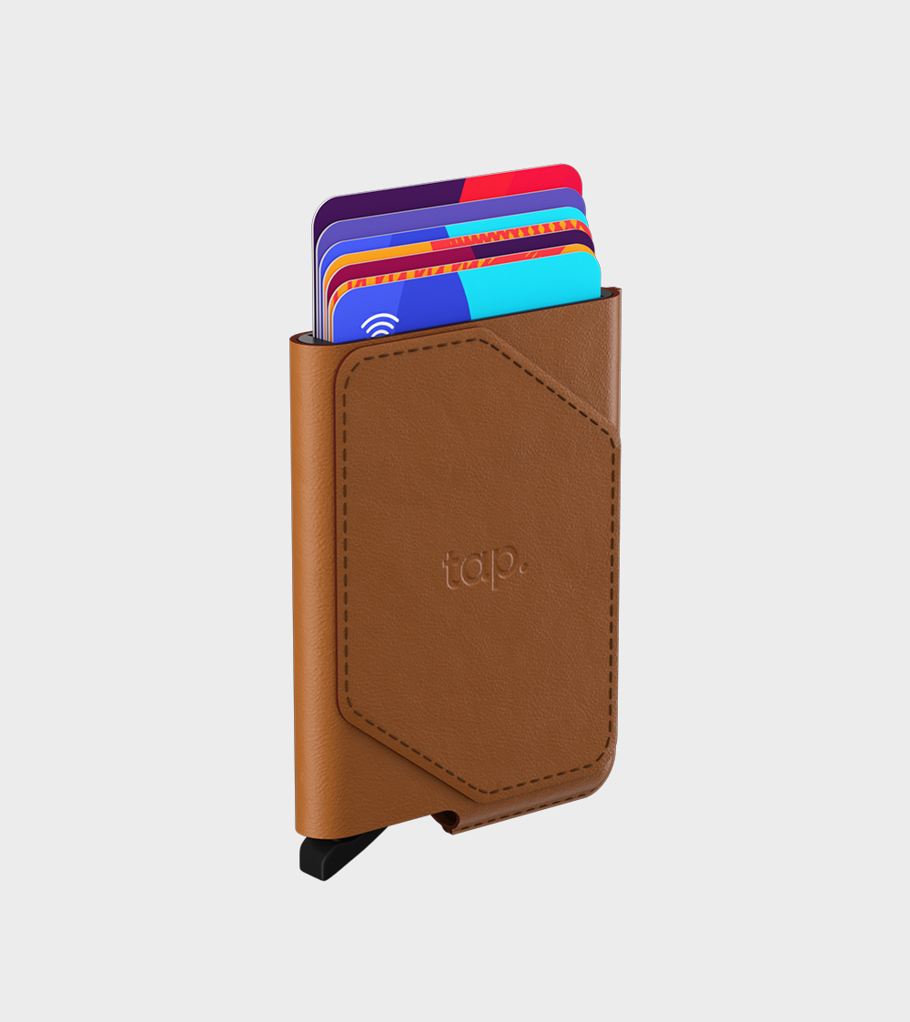Leather RFID-blocking wallet holding colorful credit cards on white background.