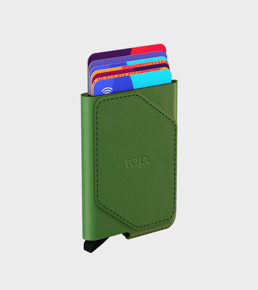 Green leather card holder with colorful cards sticking out on a white background.